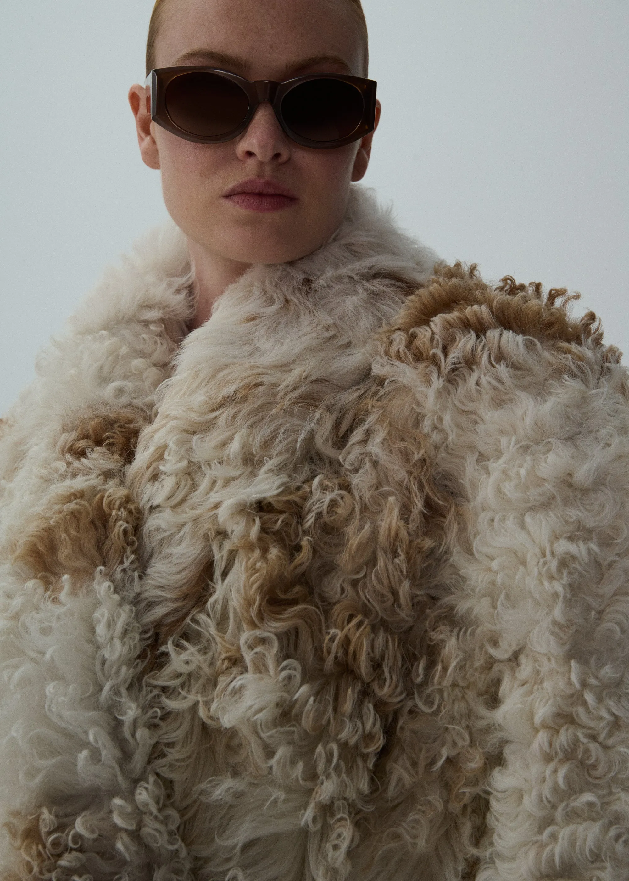 Shaggy shearling coat in white and caramel